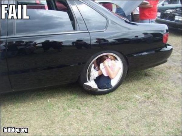 Baby Girl Fail To Sit In The Car Wheel Funny Image