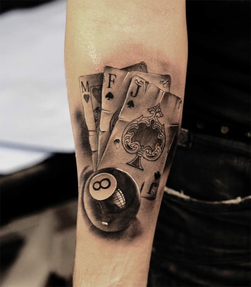 Black And Grey 3D Eight Ball With Playing Cards Tattoo On Forearm