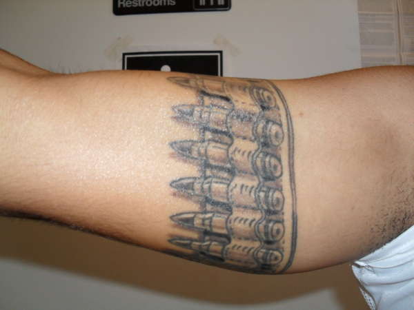 Black And Grey Bullets Tattoo On Bicep Arm Band