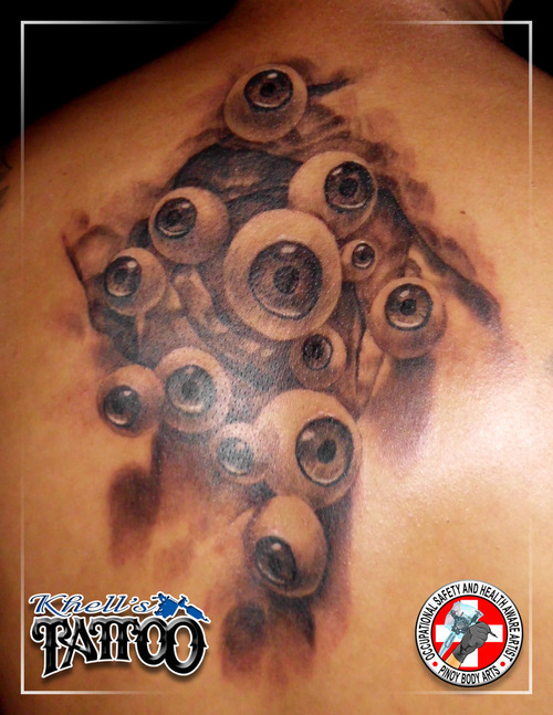 Black And Grey Ink 3D Eyeball Tattoo On Man Upper Back