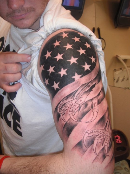 Black And Grey Patriotic USA Flag With Claw Tattoo On Man Left Half Sleeve
