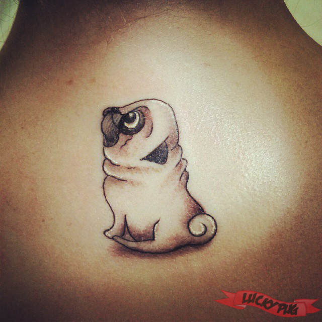 Black And Grey Pug Dog Tattoo On Upper Back