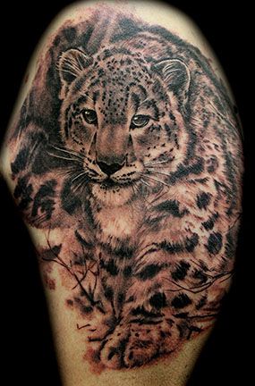 Black And Grey Snow Leopard Tattoo Design On Shoulder