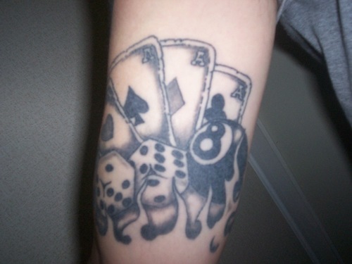 Black Ink Eight Ball With Playing Cards And Dice Tattoo Design For Arm