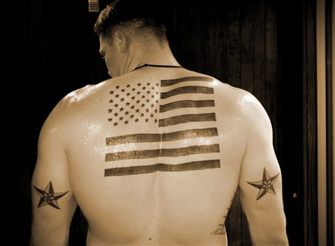 Black Ink Patriotic USA Flag Tattoo On Man Upper Back