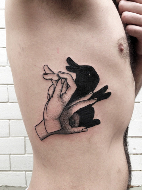 Black Ink Rabbit Shadow Tattoo On Man Side Rib