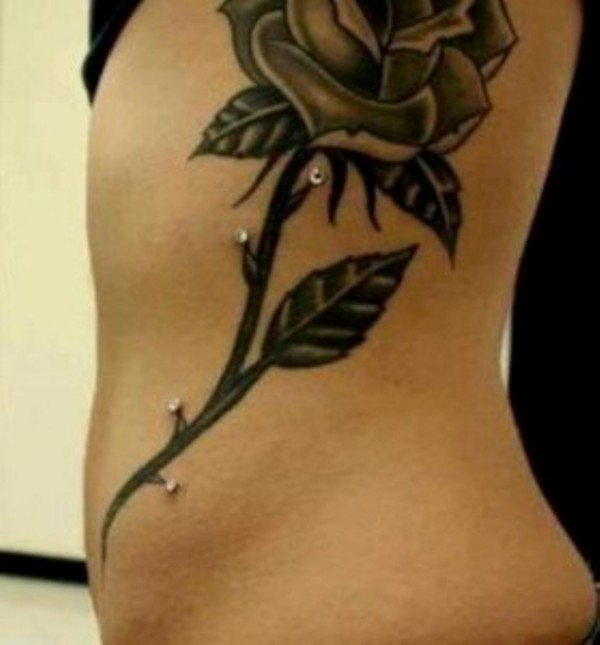 Black Ink Rose With Thorns Tattoo On Side Rib