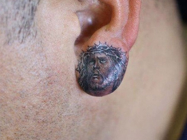 Black Ink Thorn On Jesus Head Tattoo On Ear