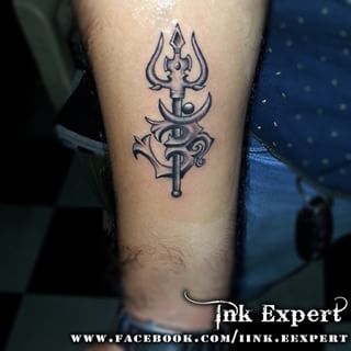 Black Ink Trishul With Om Tattoo On Forearm