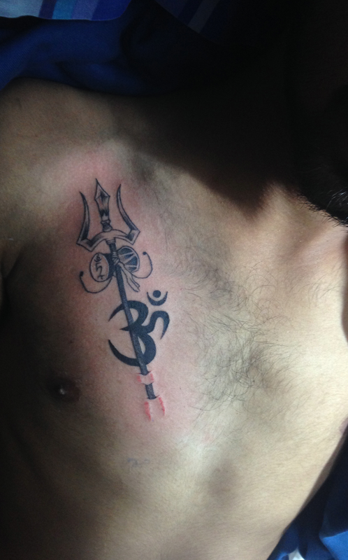 Black Ink Trishul With Om Tattoo On Man Chest