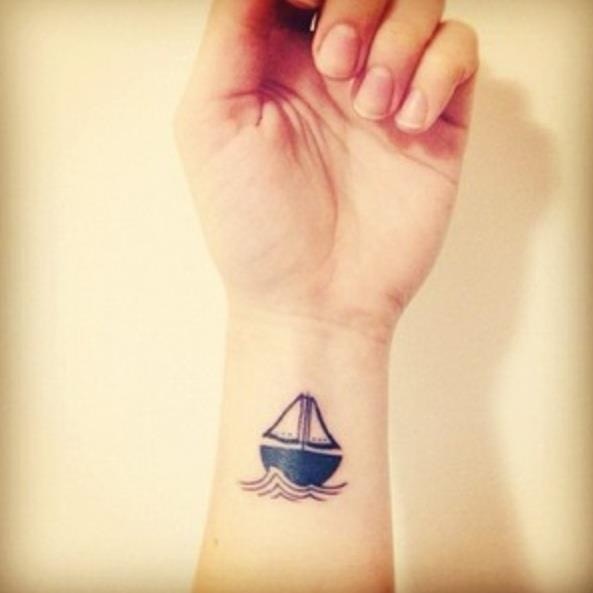 Black Little Boat Tattoo On Wrist