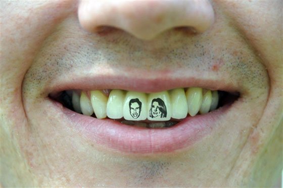 Black Man And Women Face Tattoo On Man Teeth