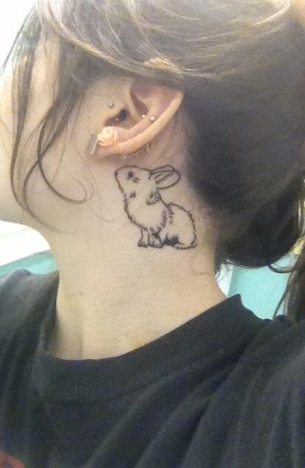 Black Rabbit Tattoo On Girl Behind The Ear