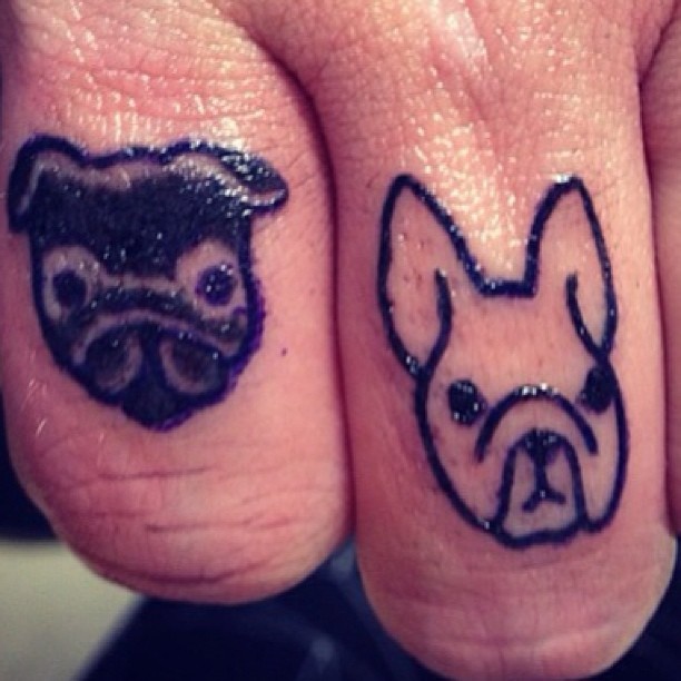 Black Two Bulldog Head Tattoo On Fingers