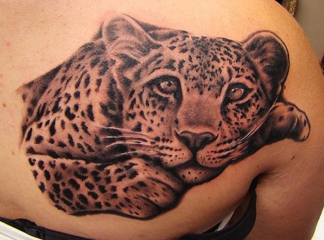 Black and grey Cute sitting leopard tattoo on back shoulder