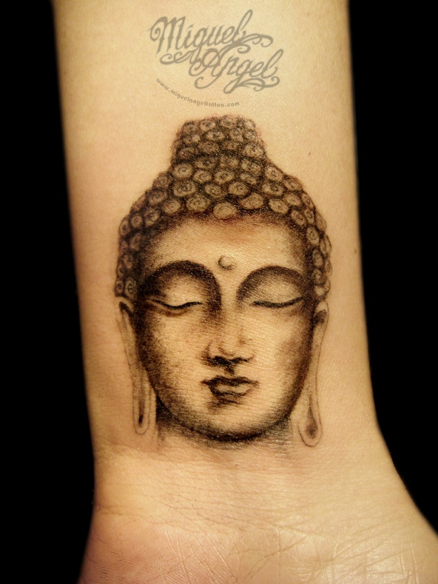 Buddha head tattoo design on wrist