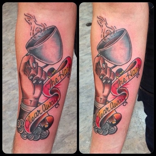 Coffee Cup In Hand With Banner Tattoo On Forearm