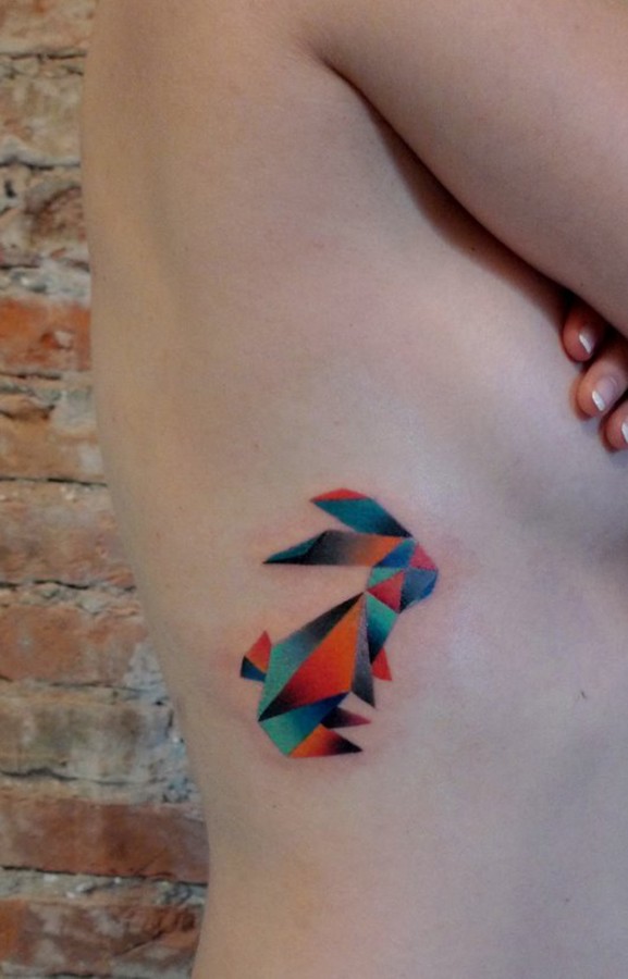Colorful Geometric Rabbit Tattoo On Girl Upper Side Rib