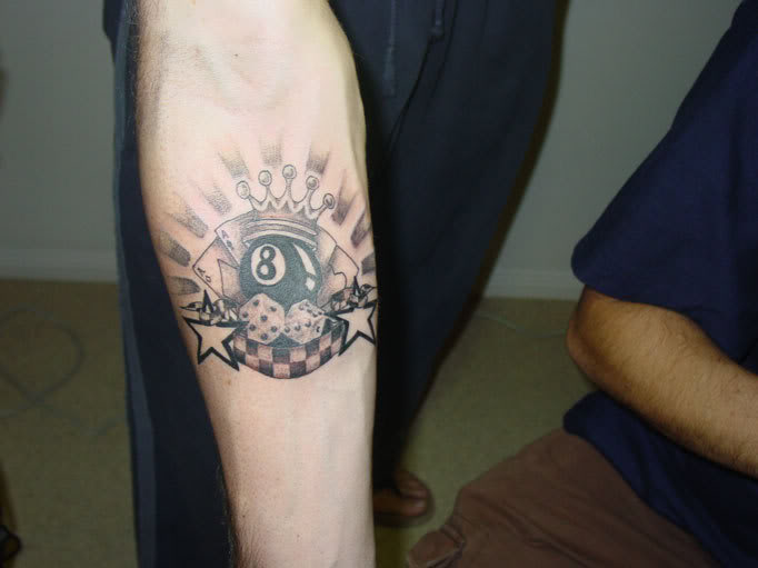 Eight Ball With Dice And Star Tattoo On Forearm