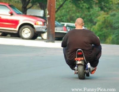 Funny Fat Man Riding Tiny Bike