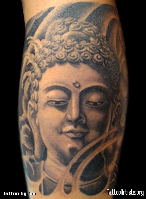 Grey ink Buddha head tattoo on arm