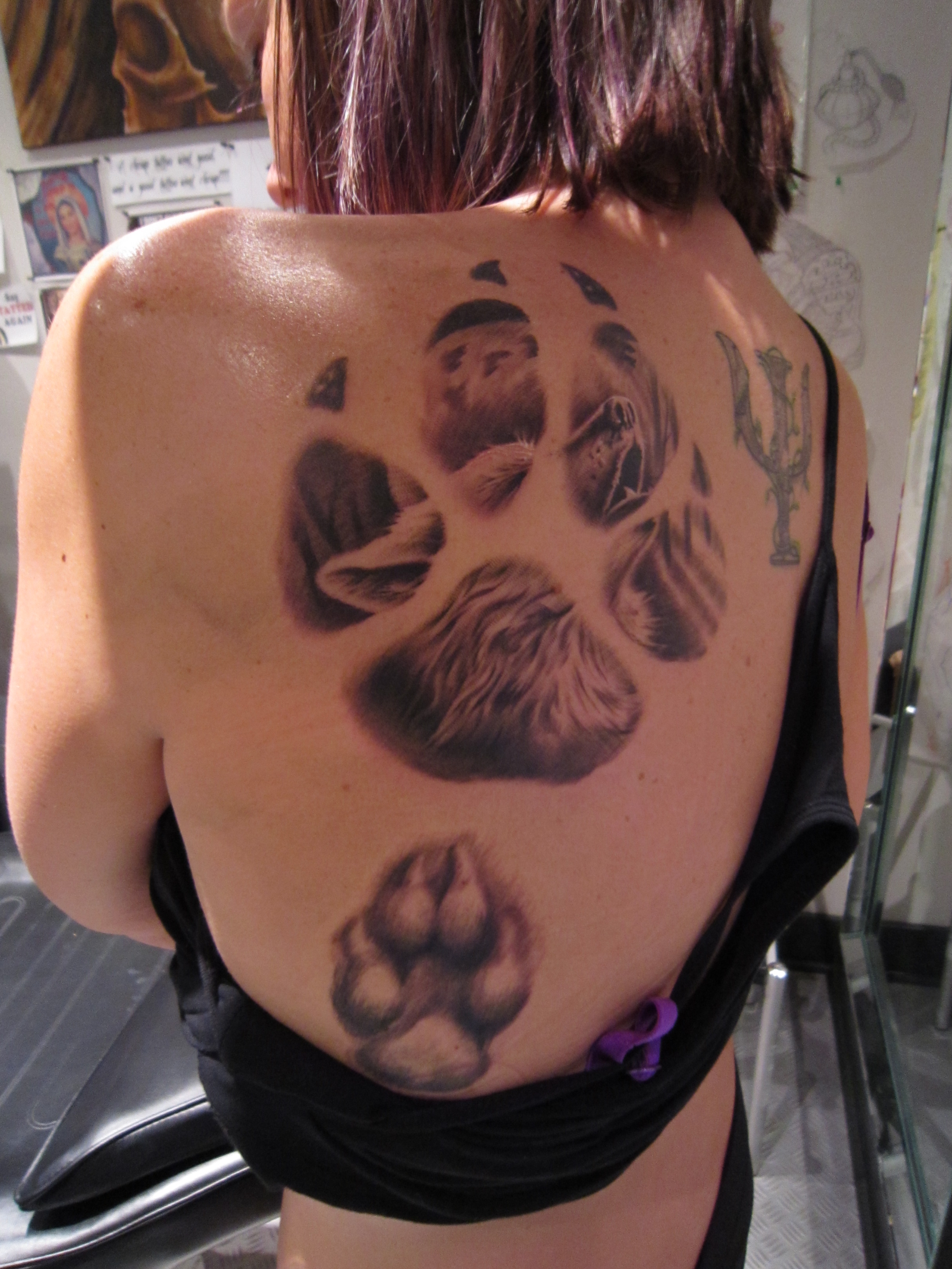 Large Leopard Paw Tattoo On Upper Back