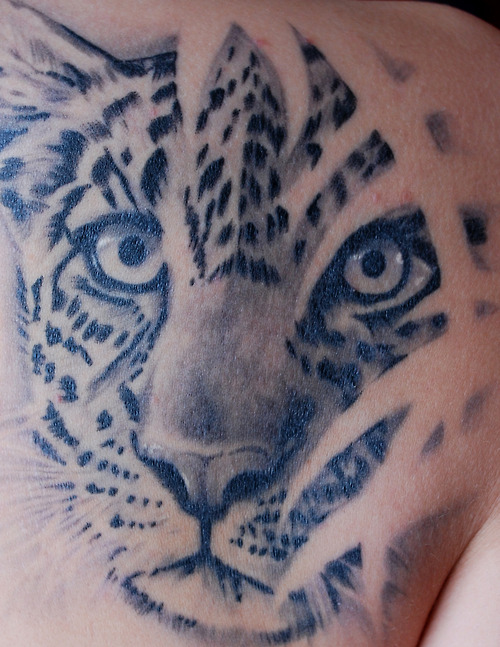 Leopard face print tattoo