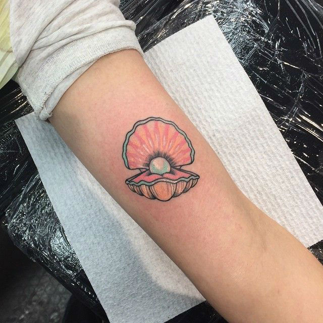 Pearl In Shell Tattoo On Forearm