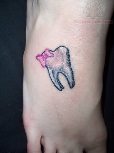 Pink Bow With Teeth Tattoo On Foot