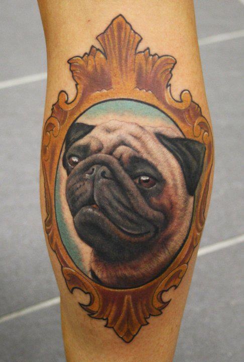 Realistic Pug Face In Frame Tattoo On Leg Calf