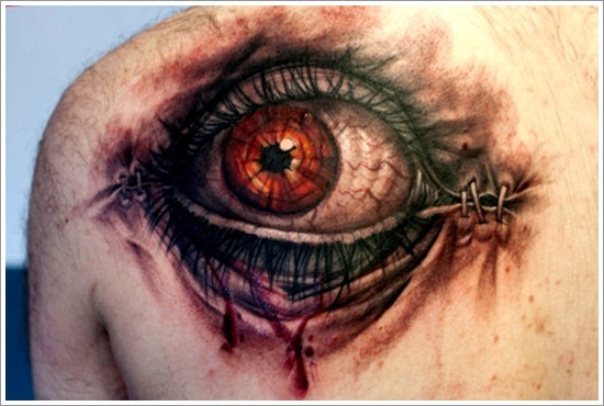 Ripped Skin Eyeball Tattoo On Left Back Shoulder