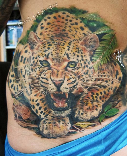 Roaring Realistic Leopard Tattoo on hip by Mirek vel Stotker