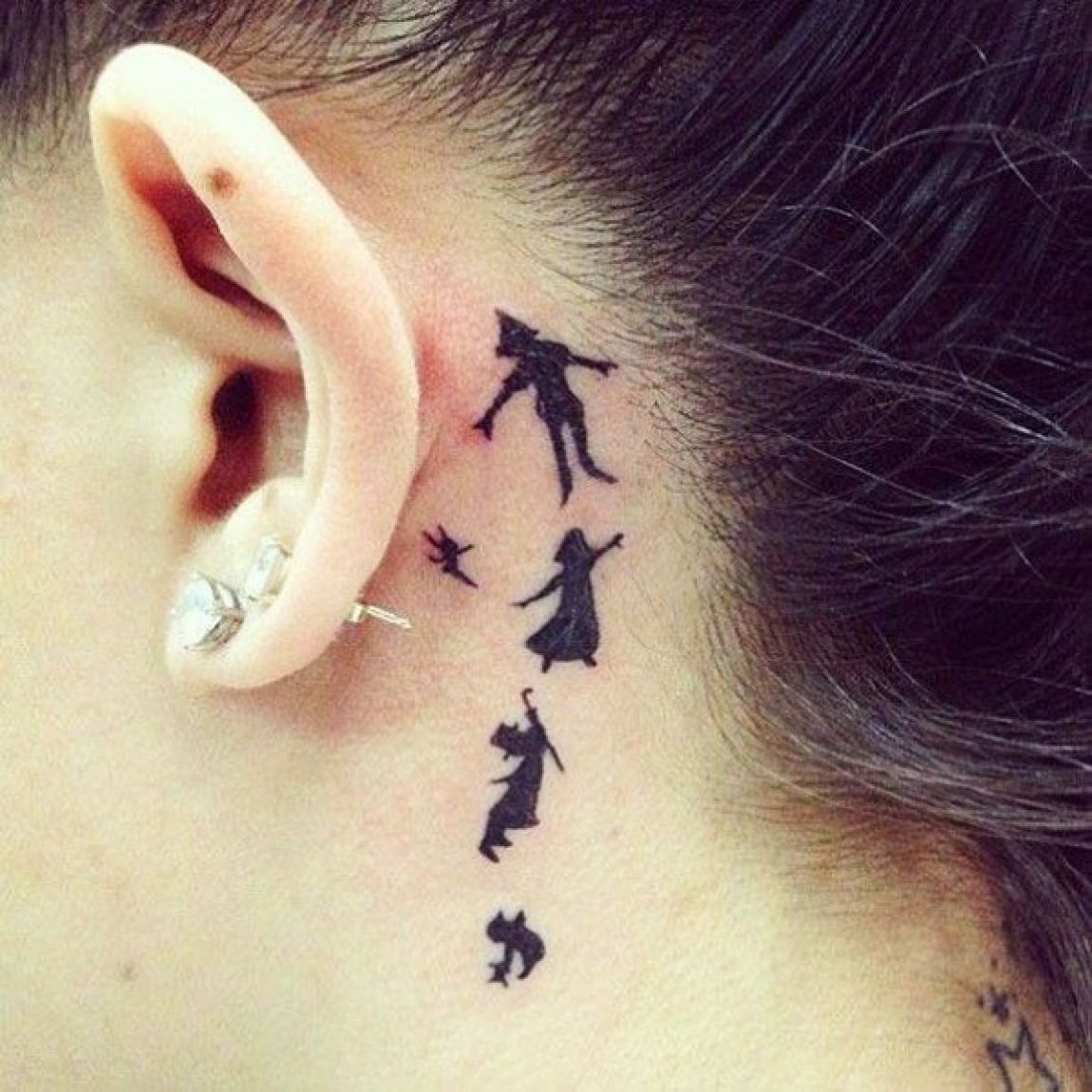 Silhouette Disney Characters Tattoo On Girl Behind The Ear