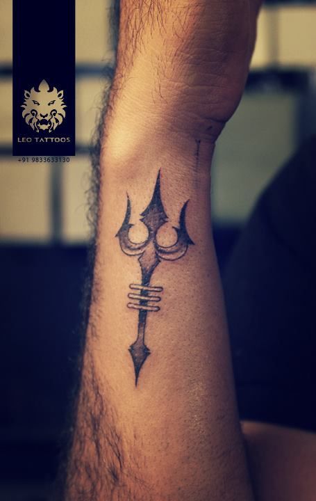 Unique Black Trishul Tattoo On Side Wrist