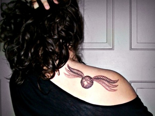 Awesome Harry Potter Snitch Tattoo On Girl Right Back Shoulder