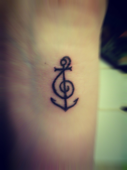 Black Anchor With Treble Clef Tattoo Design For Wrist