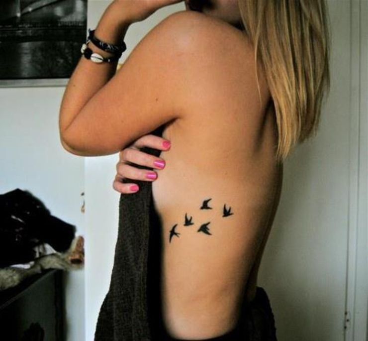 Black Five Flying Seagulls Tattoo On Girl Side Rib