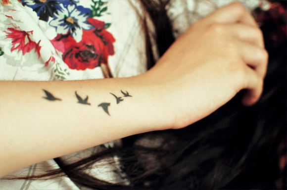 Black Five Flying Seagulls Tattoo On Upper Wrist