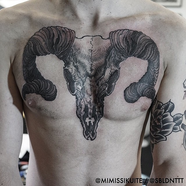 Black Ink Sheep Skull Tattoo On Man Chest