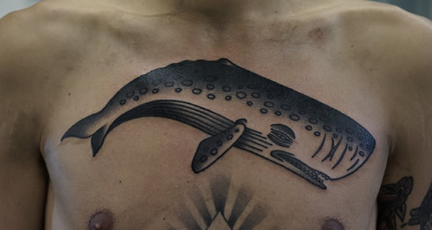 Black Ink Whale Tattoo On Man Chest By Philip Yarnell