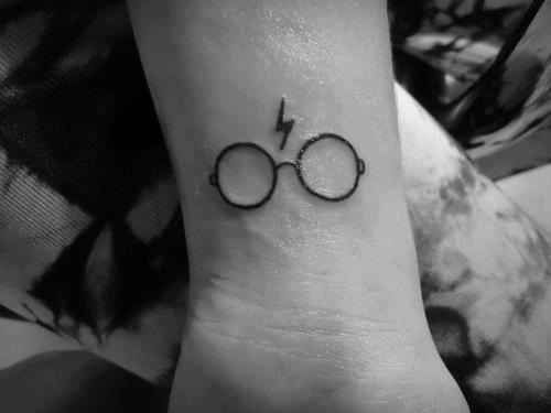 Black Outline Harry Potter Specs Tattoo On Wrist