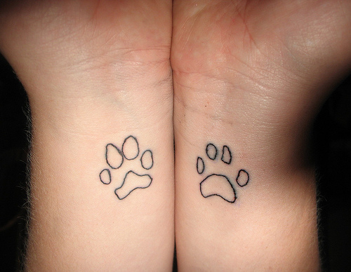Black Outline Two Leopard Paw Print Tattoo On Both Wrist