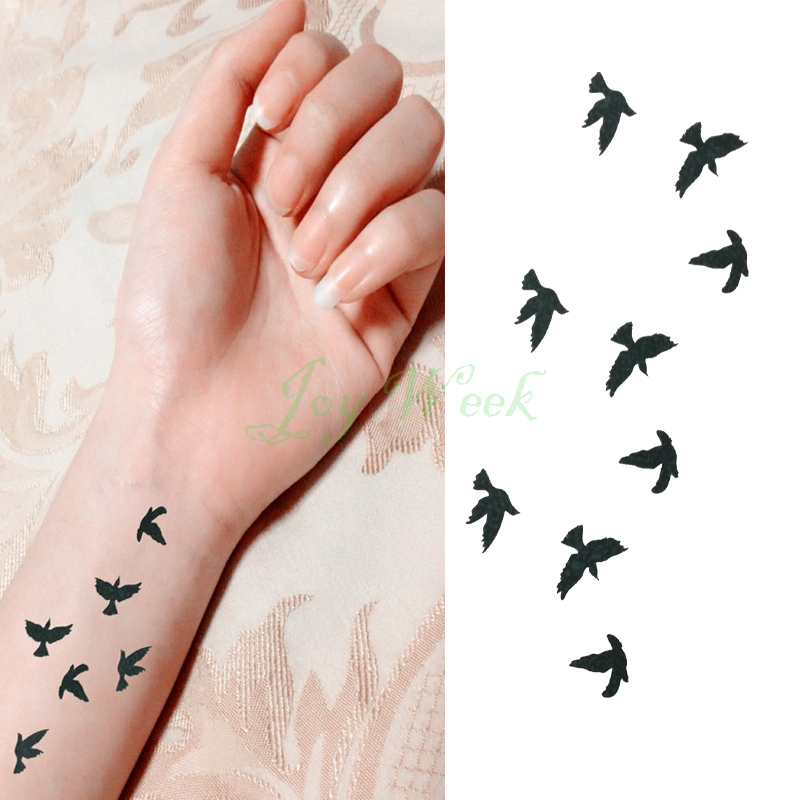Black Six Flying Seagull Tattoo On Wrist
