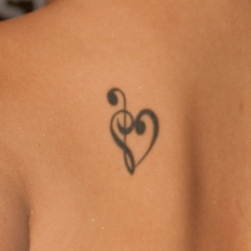 Black Treble Clef Heart Tattoo On Left Back Shoulder