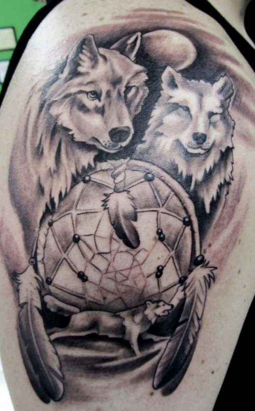 Grey Ink Dreamcatchers And Wolf Head Tattoos On Head