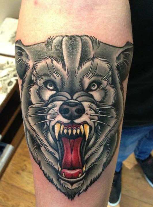 Grey Wolf Head Traditional Tattoo On Sleeve