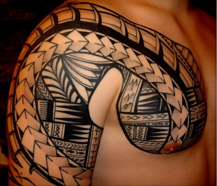 Hawaiian Tribal Tattoo On Chest And Half Sleeve