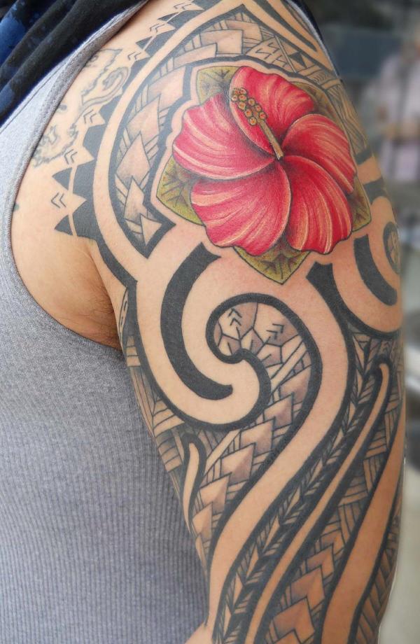 Hawaiian Tribal Tattoo On Left Half Sleeve And Lily Flower Tattoo