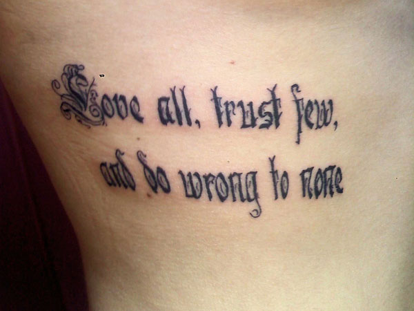 Love All Trust Few And Do Wrong To None – Love Quote Tattoo On Rib Cage