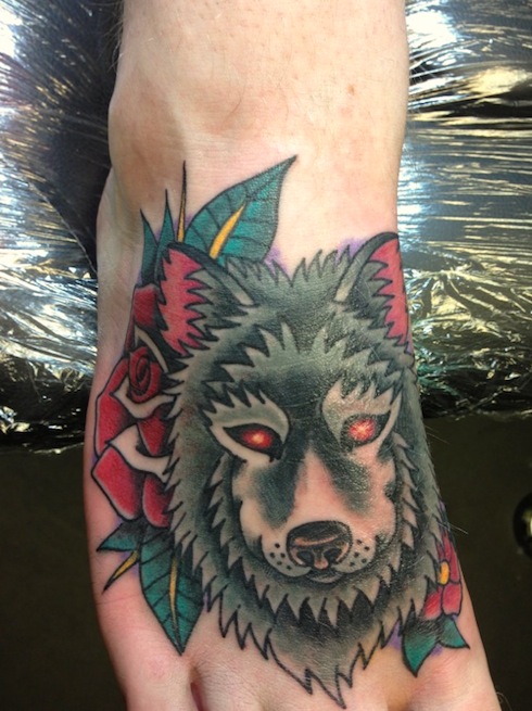 Red Rose Flower And Wolf Head Tattoo On Right Foot